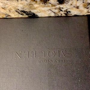 Alexander McQueen gold card holder with tags. Pristine and unused